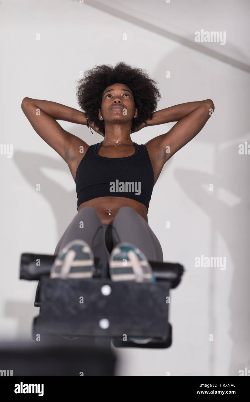 African american woman doing sit ups hi-res stock photography and ...