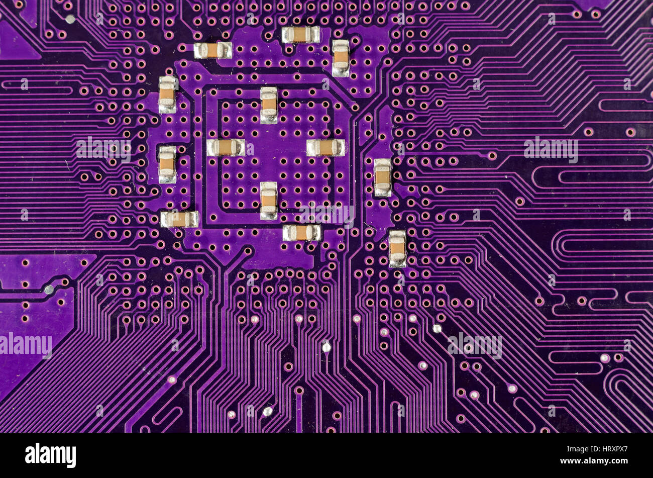 Electronic circuit plate background purple Stock Photo