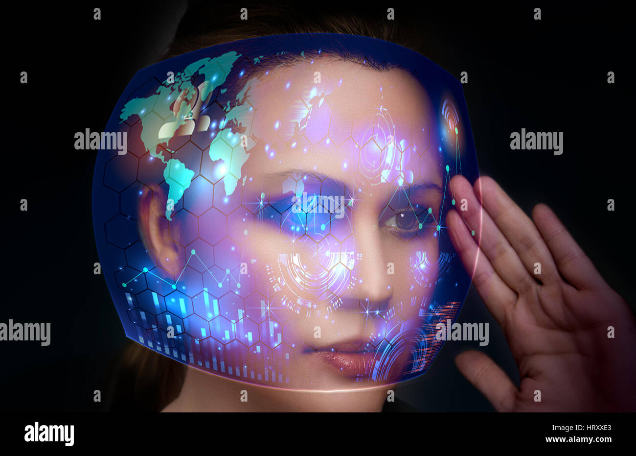 Close-up portrait of young and beautiful woman with the virtual futuristic glasses ( technology concept).Virtual holographic interface and young woman Stock Photo