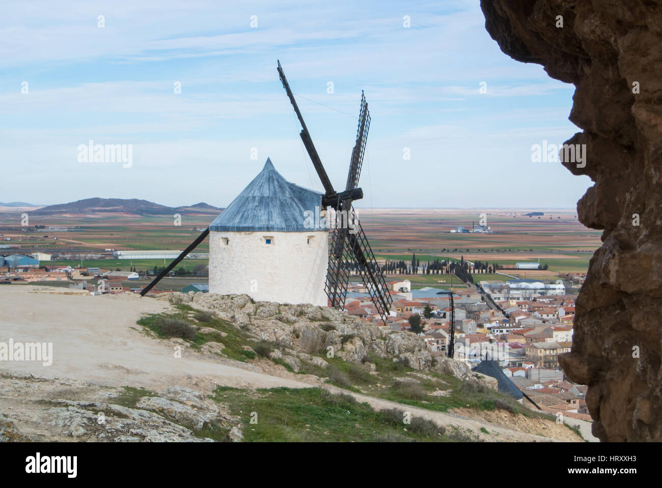 White old windmills on the hill near Consuegra (Castilla La Mancha, Spain), a symbol of region and journeys of Don Quixote (Alonso Quijano) and a town Stock Photo