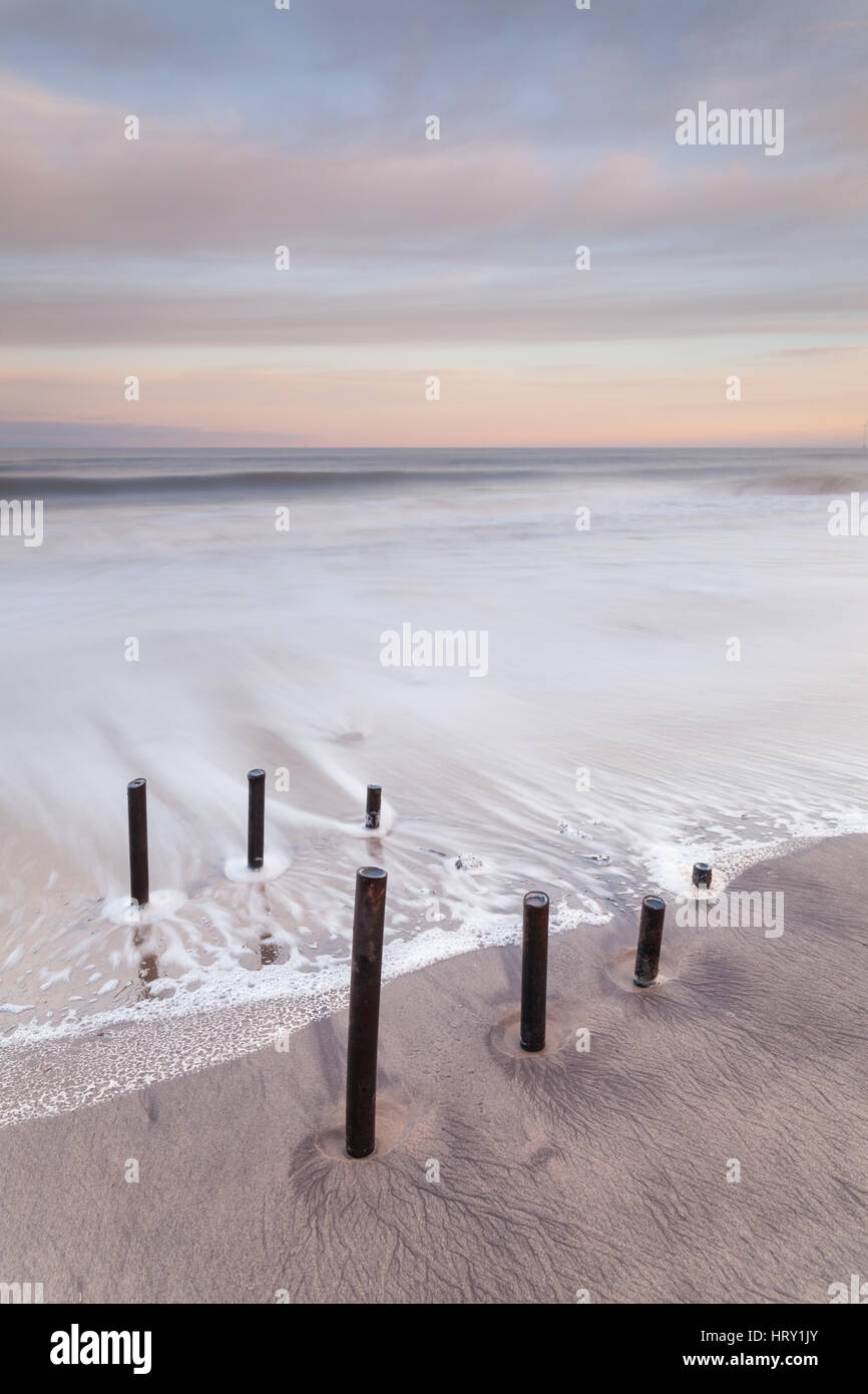Cambois beach, Northumberland, at sunset and high tide along the North East Coast Stock Photo