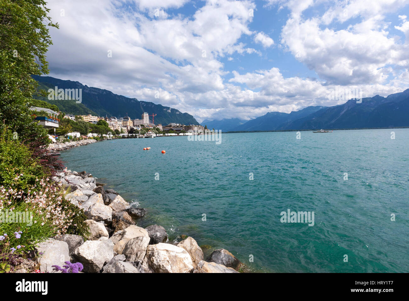 Shore of Lake Geneva in Montreux with the Alps behind Stock Photo - Alamy