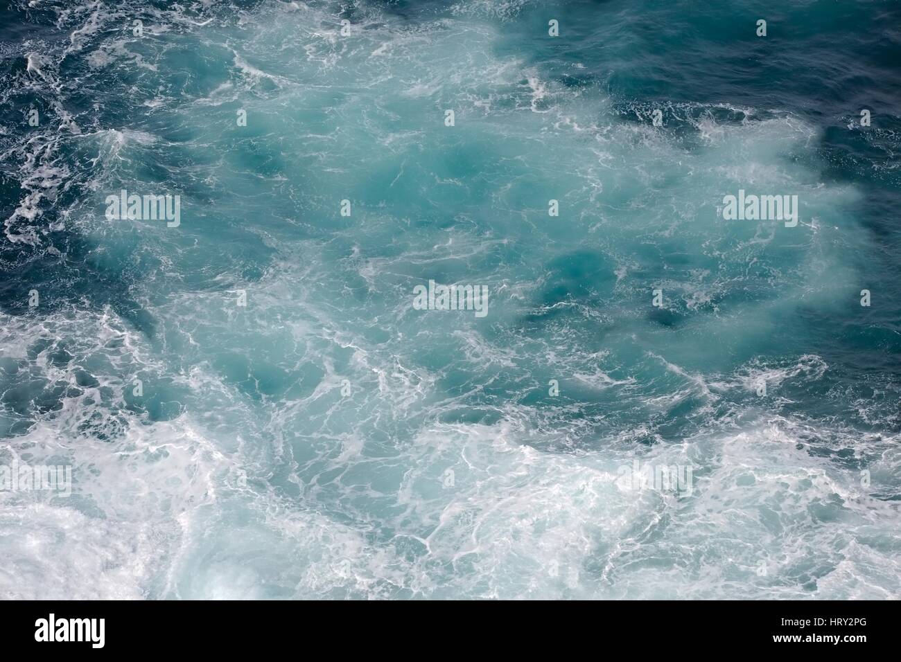 Waves hitting shore Stock Photo - Alamy