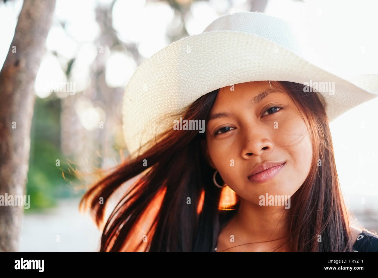 Summer portrait of beautiful young Asian girl with hat Stock Photo