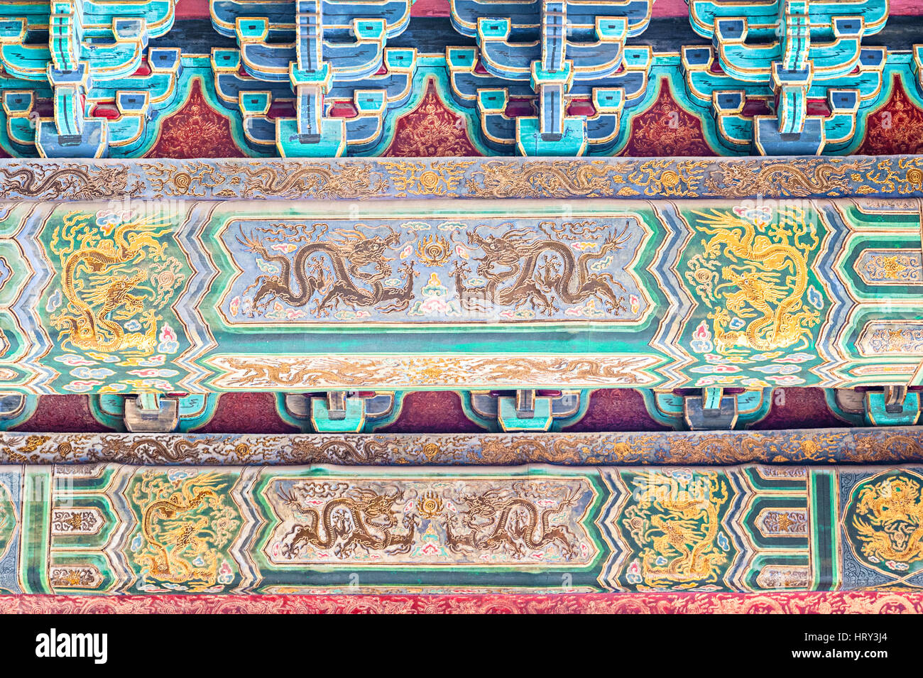Gold foil painting on the ceiling of building in Forbidden City Stock Photo