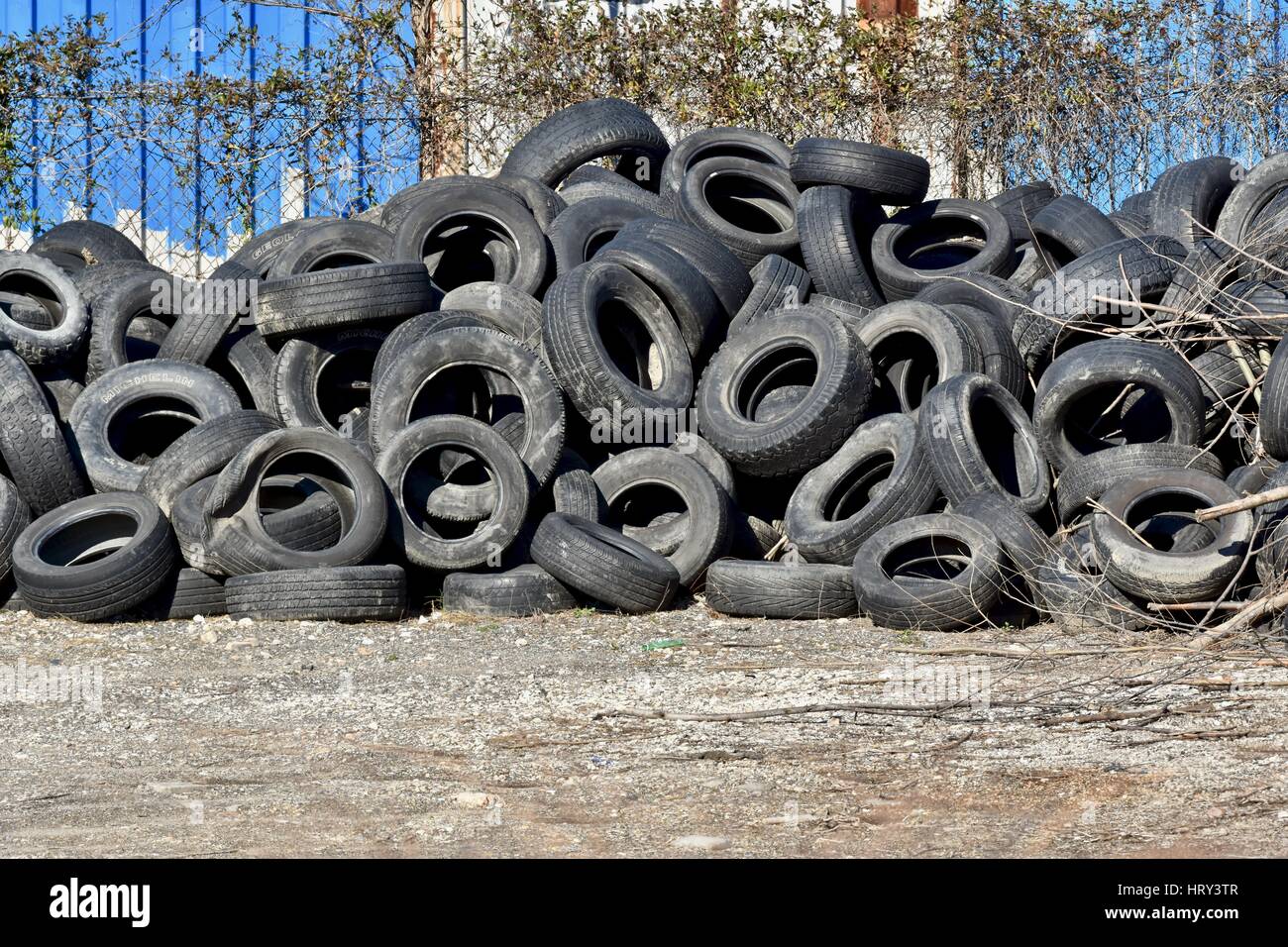 Pile of used tires in a junk yard Stock Photo Alamy