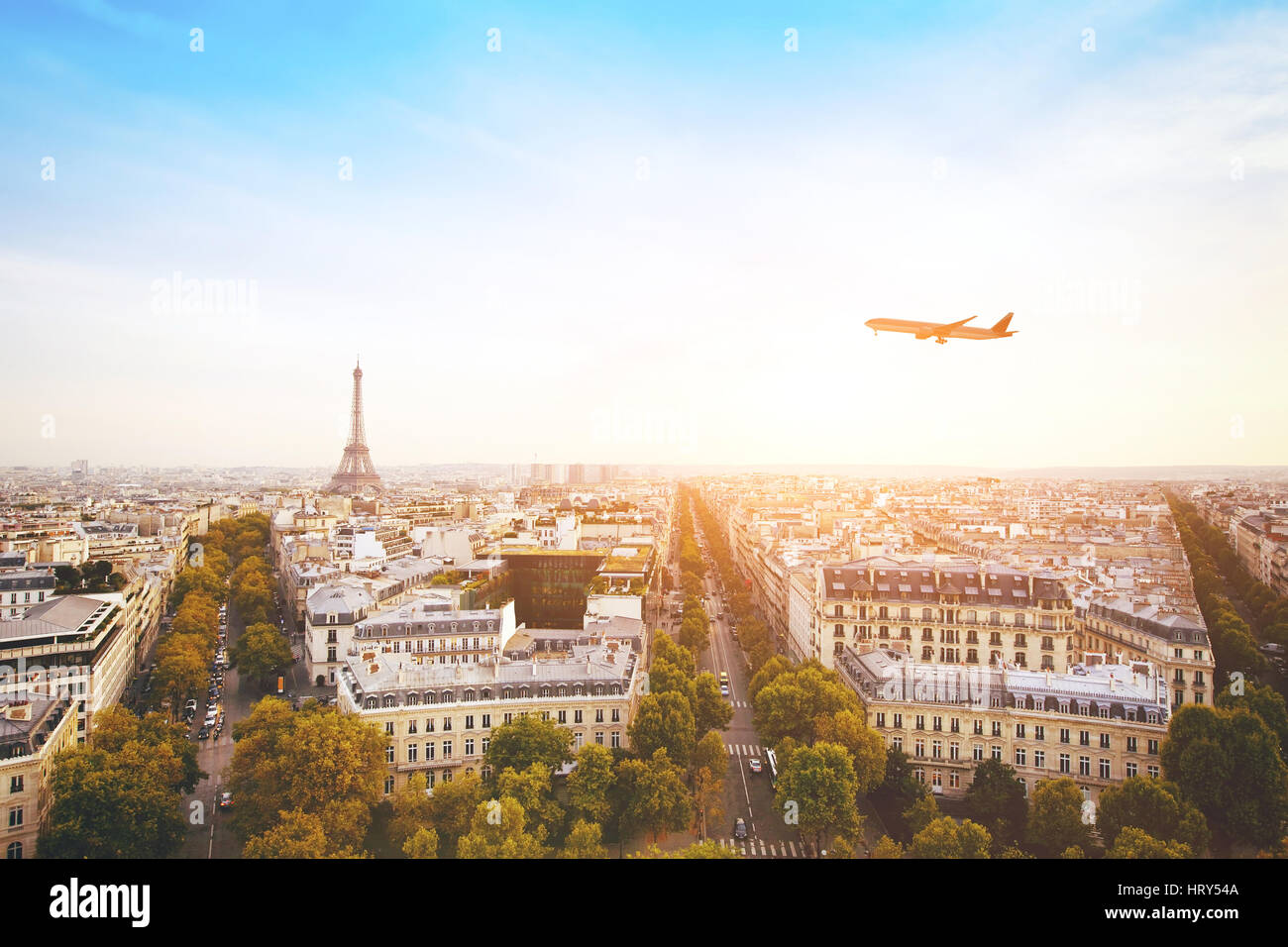 travel to France, airplane flying over beautiful panoramic cityscape of Paris with Eiffel Tower Stock Photo