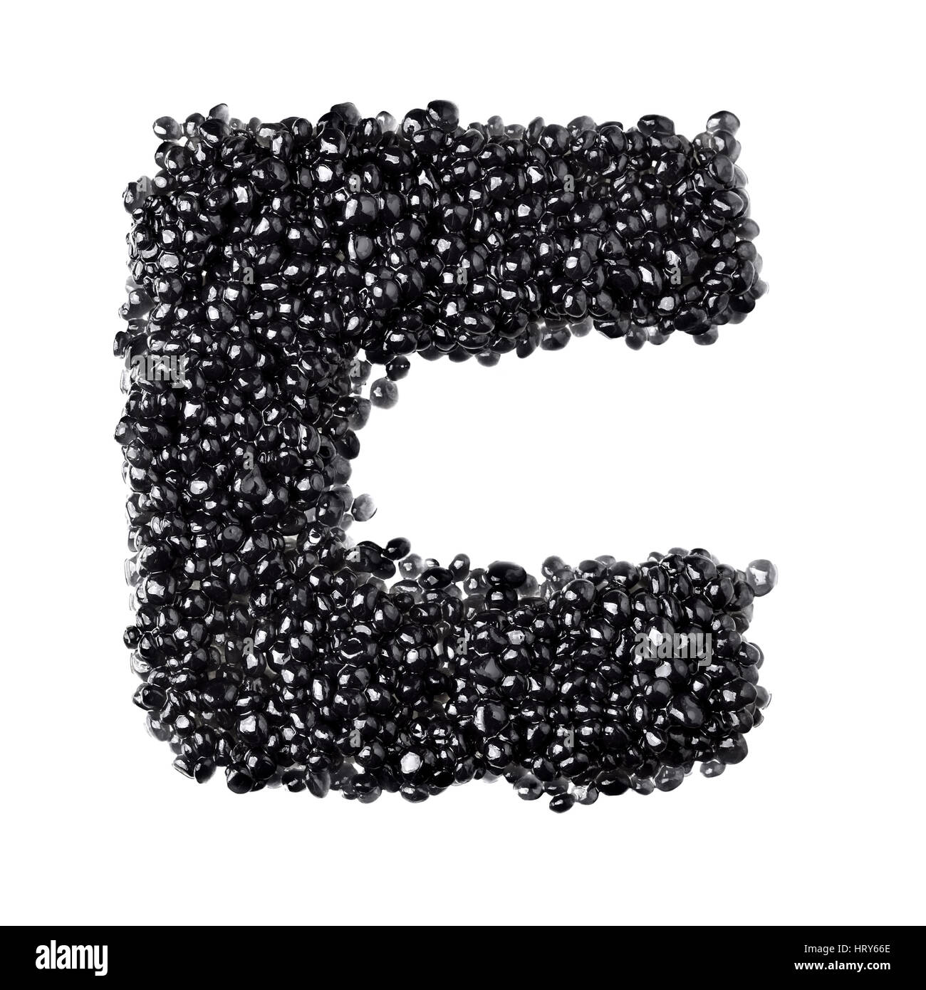 C - Alphabet made from black caviar Stock Photo