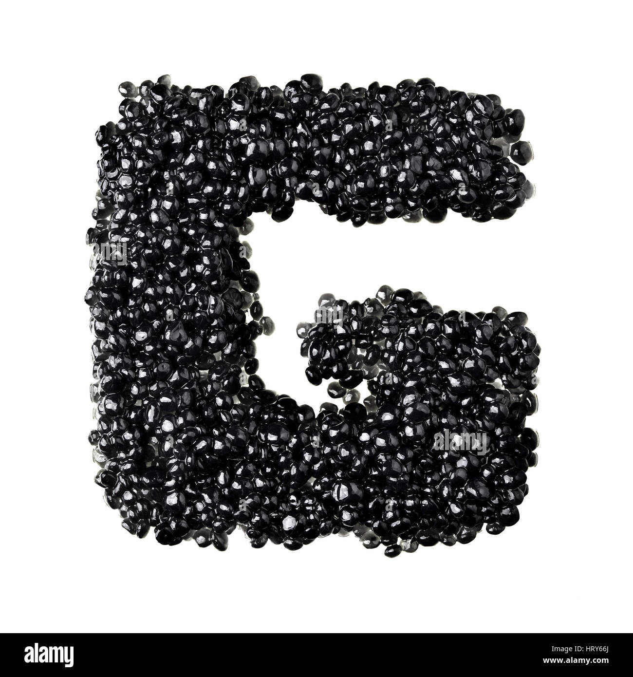 G - Alphabet made from black caviar Stock Photo