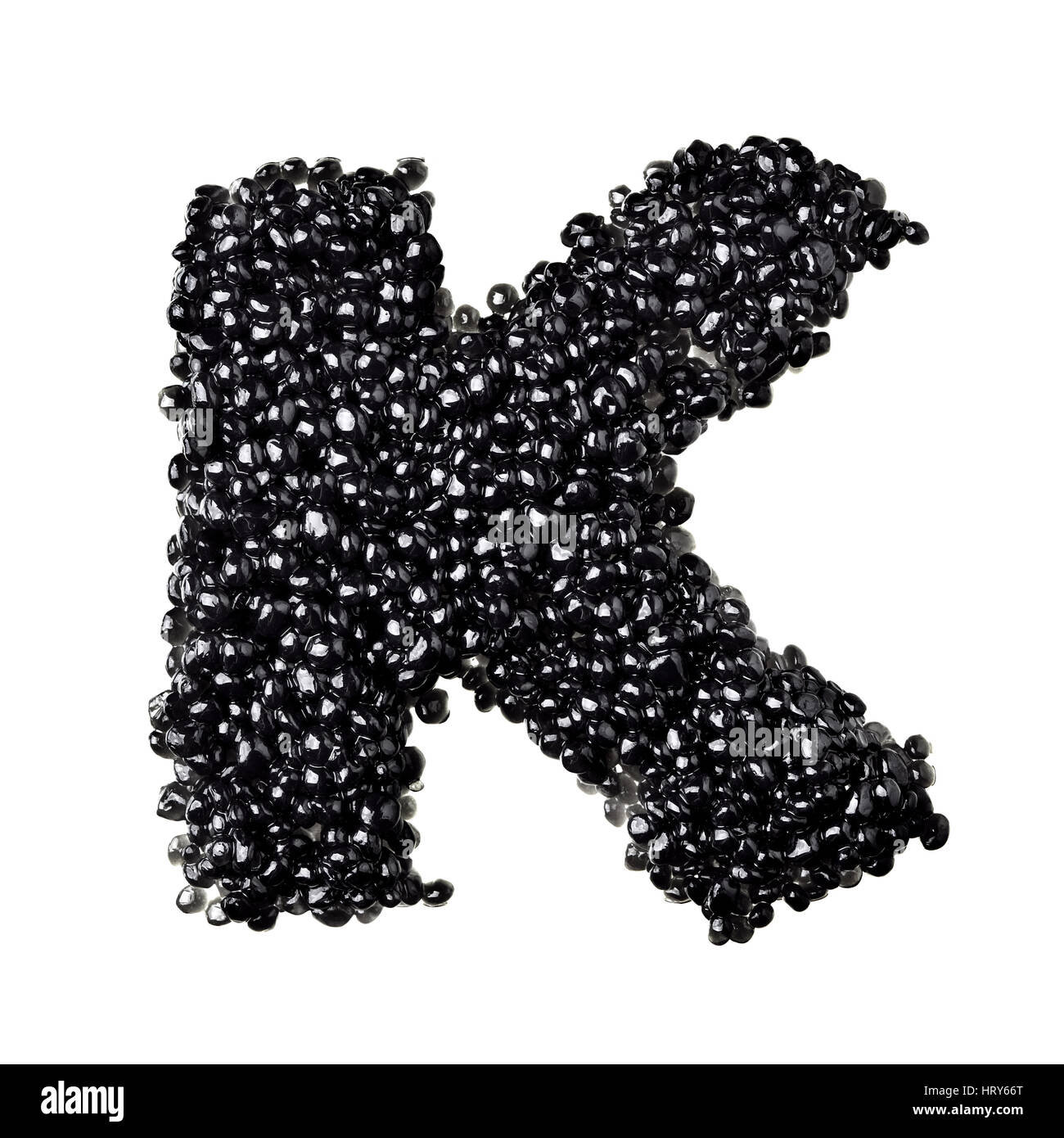 K - Alphabet made from black caviar Stock Photo
