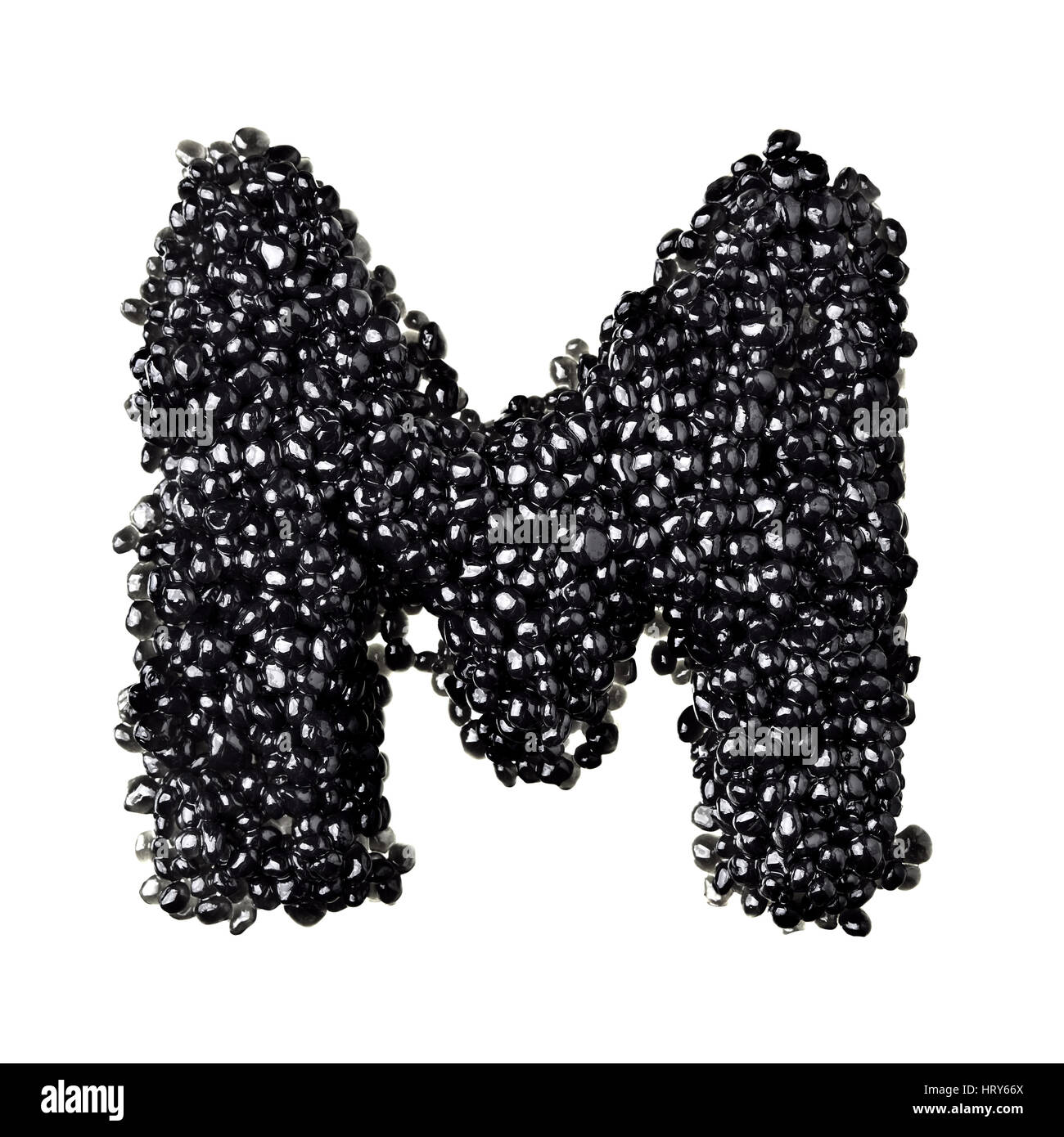 M - Alphabet made from black caviar Stock Photo