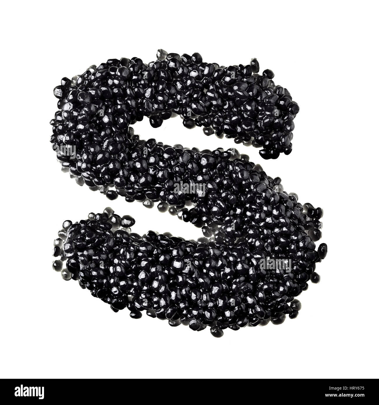 S - Alphabet made from black caviar Stock Photo