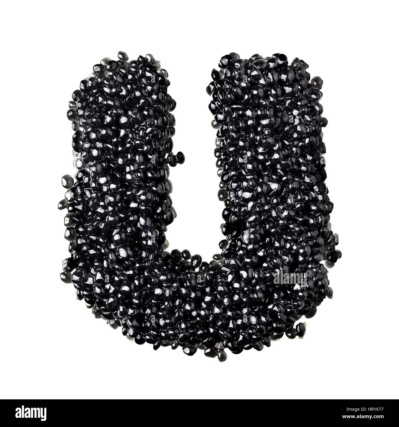 U - Alphabet made from black caviar Stock Photo