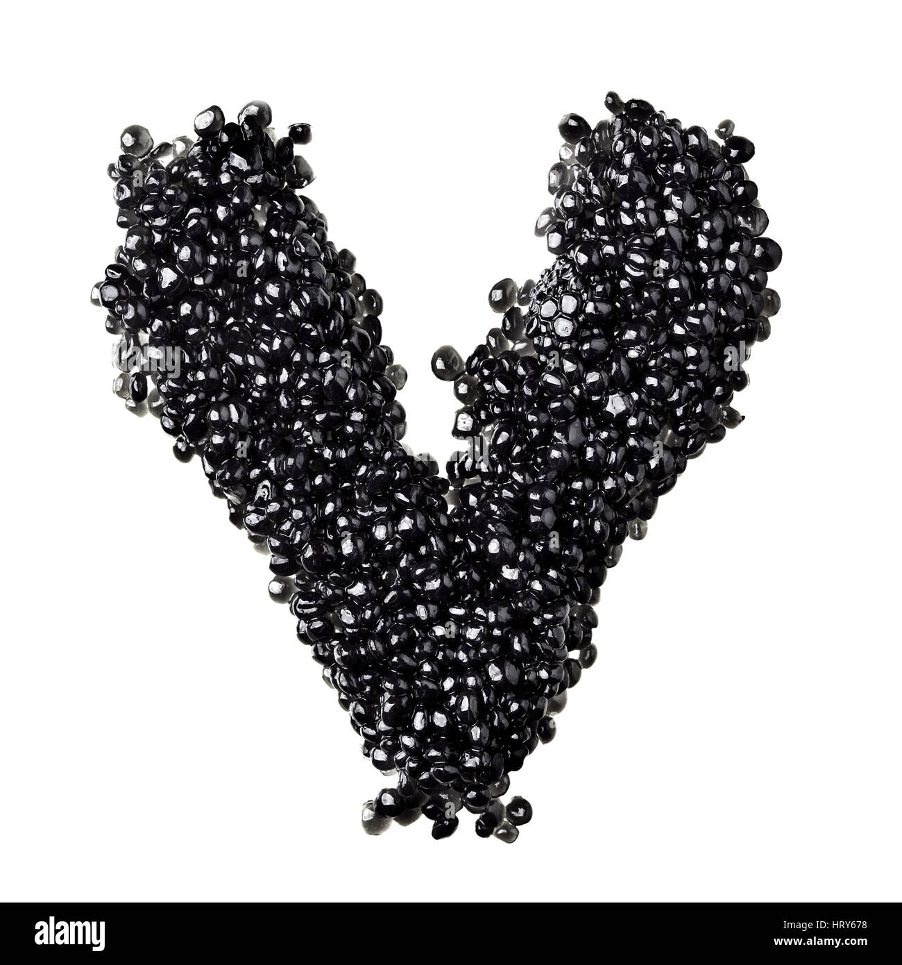 V - Alphabet made from black caviar Stock Photo