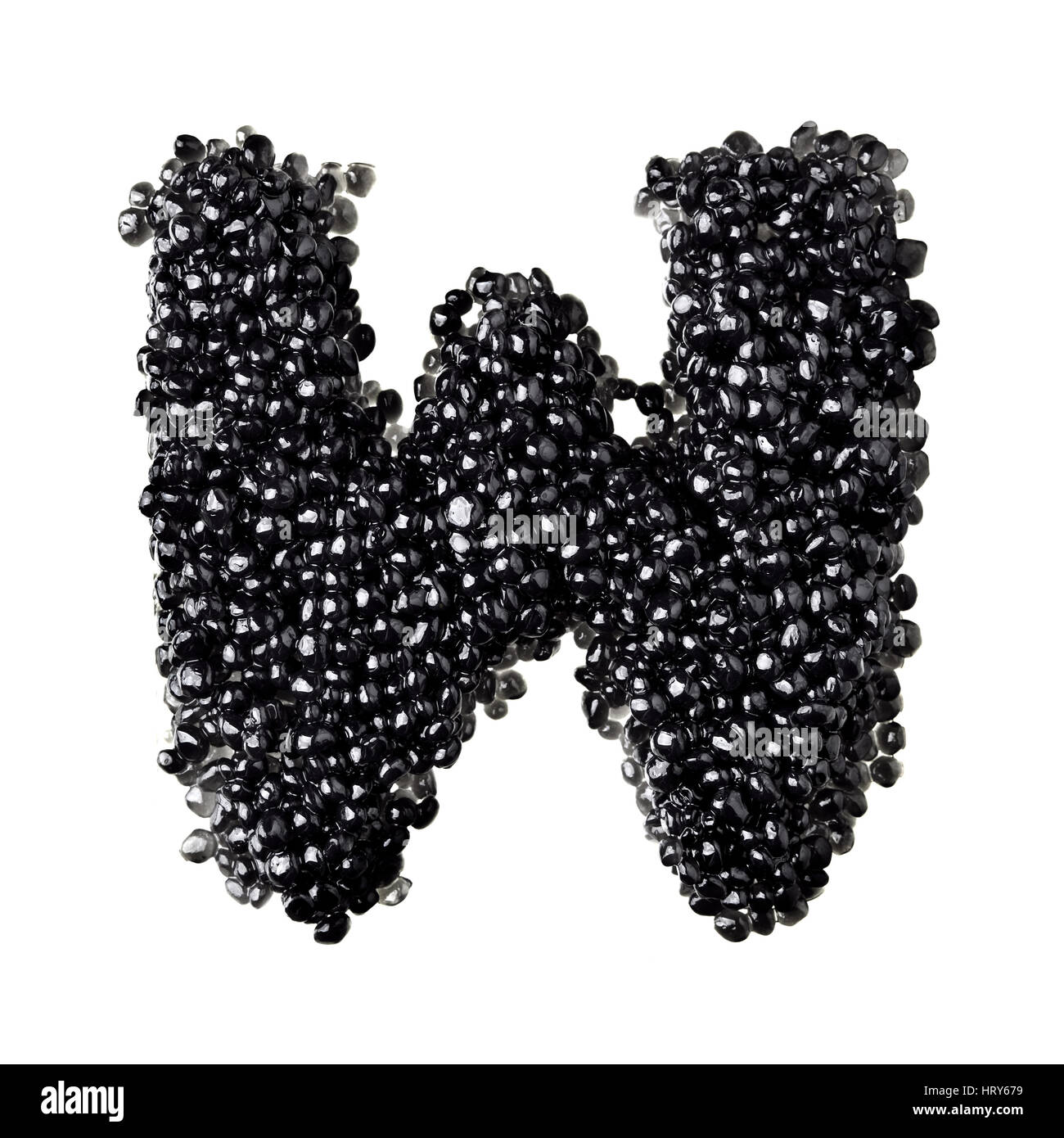 W - Alphabet made from black caviar Stock Photo