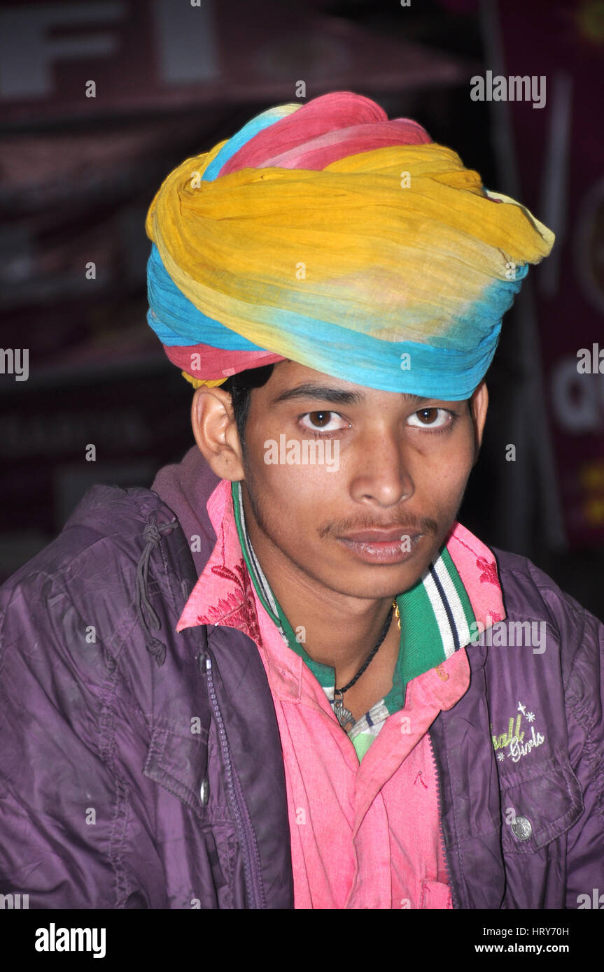A Boy, Brightly coloured turban (Traditional Cap), Rajasthan, India (Photo Copyright © by Saji Maramon) Stock Photo