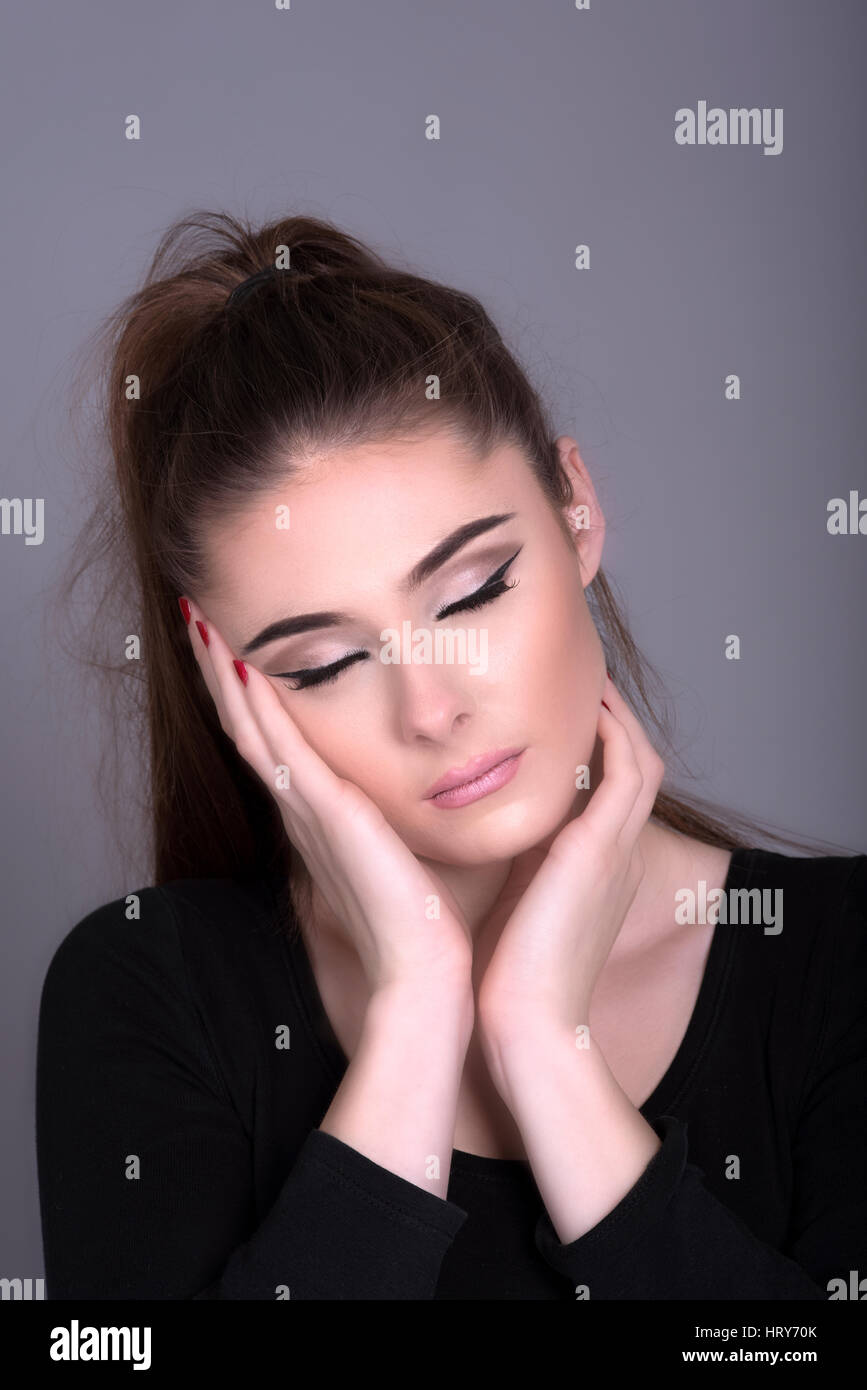 Hand Rested On Side Woman resting face on hand with eyes closed hi-res stock photography ...
