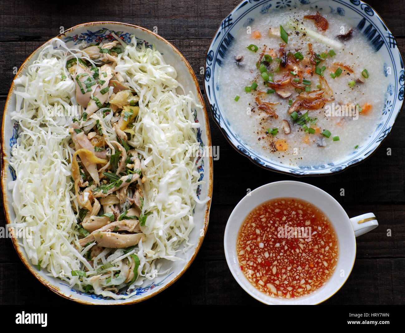 Asian food for sick people, chicken rice gruel from rice, carrot, onion, agaric, cabbage. Bowl of chicken porridge with vegetable, call chao ga Stock Photo