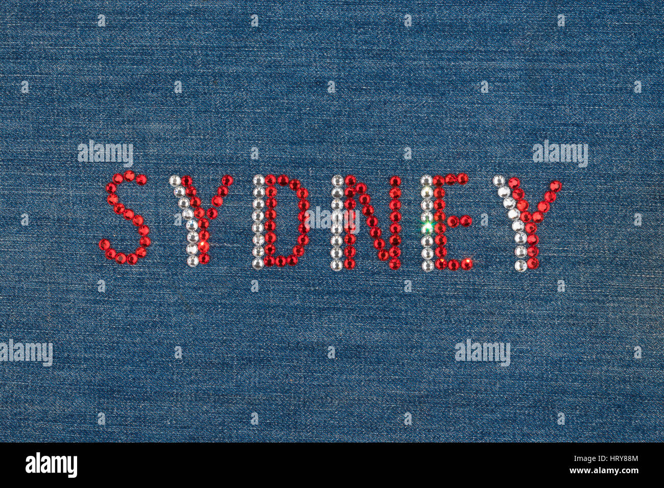 Inscription Sydney, inlaid rhinestones on denim. View from above Stock Photo