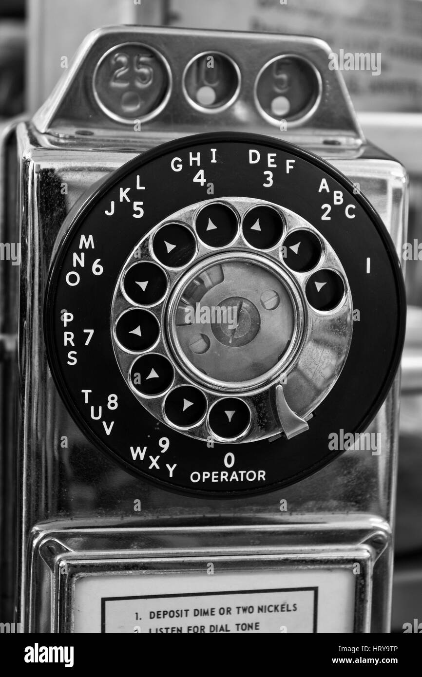Vintage Rotary Pay Phone - Old Pay Telephone with Coin Slots Stock Photo