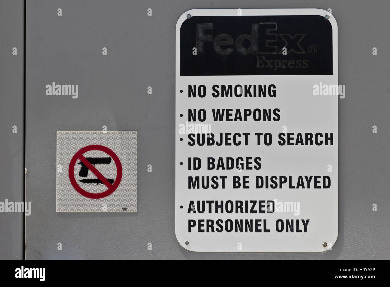 Indianapolis: Circa June 2016: No Smoking No Weapons Sign at a Federal Express Location. FedEx is a Worldwide Delivery Company X Stock Photo