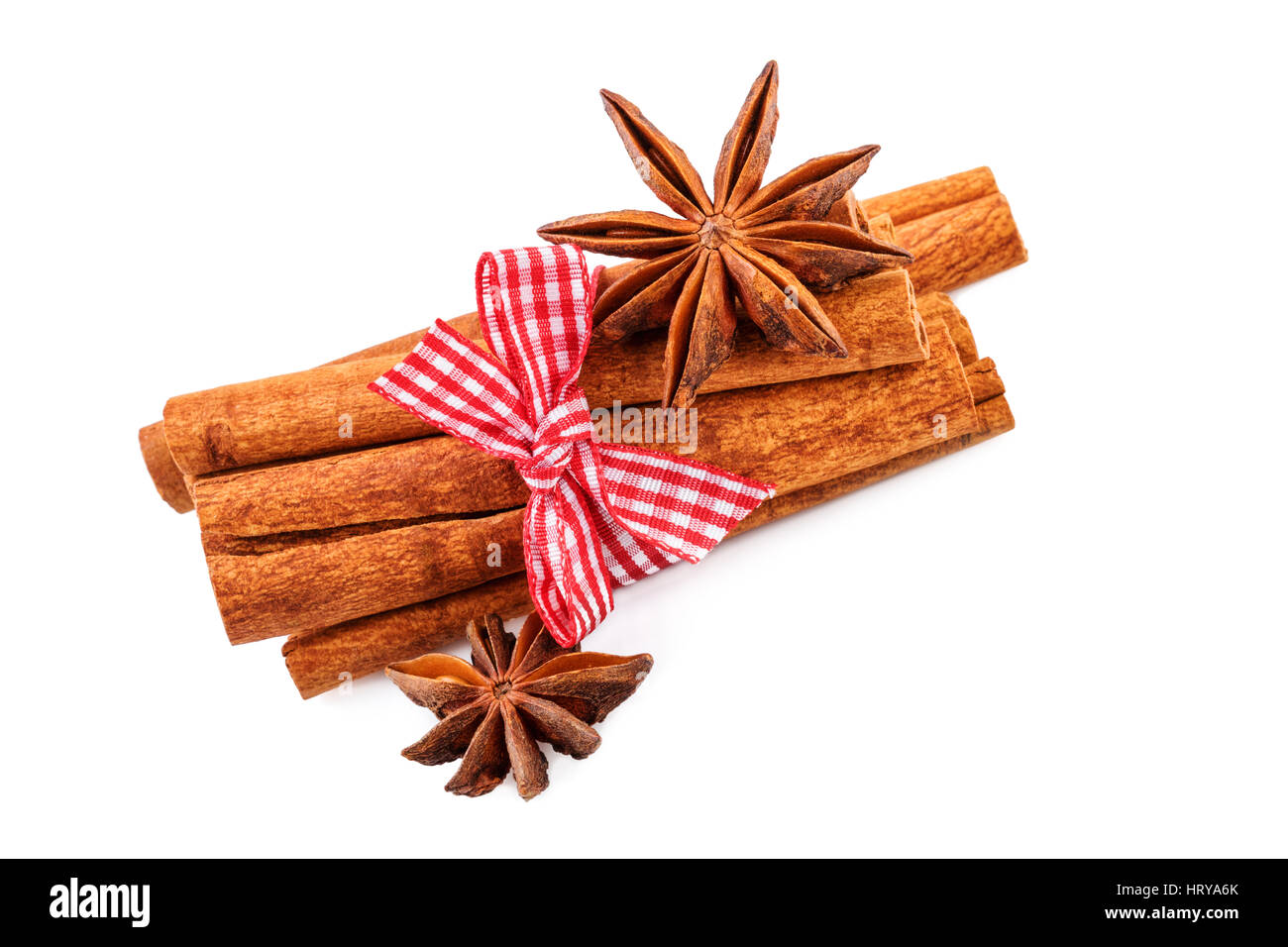 cinnamon sticks and anise stars on white Stock Photo