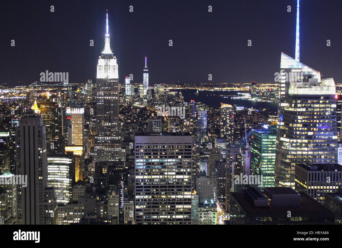 NEW YORK, USA - April 27 2014: The Empire State Building in the skyline of New York at night. Stock Photo