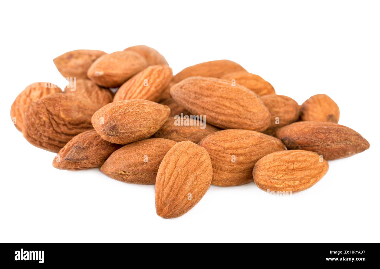 Almond closeup. Heap of shelled almond nuts isolated on white Stock Photo