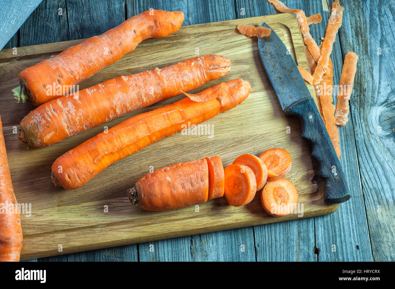 cutting process carrot on the kitchen board, top view Stock Photo