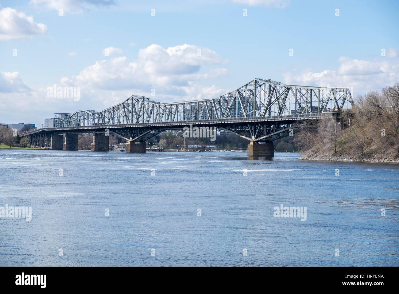 Spanning the Ottawa River the Royal Alexandra Interprovincial Bridge or Alexandra Bridge joins Ottawa Ontario and Gatineau Quebec. Stock Photo