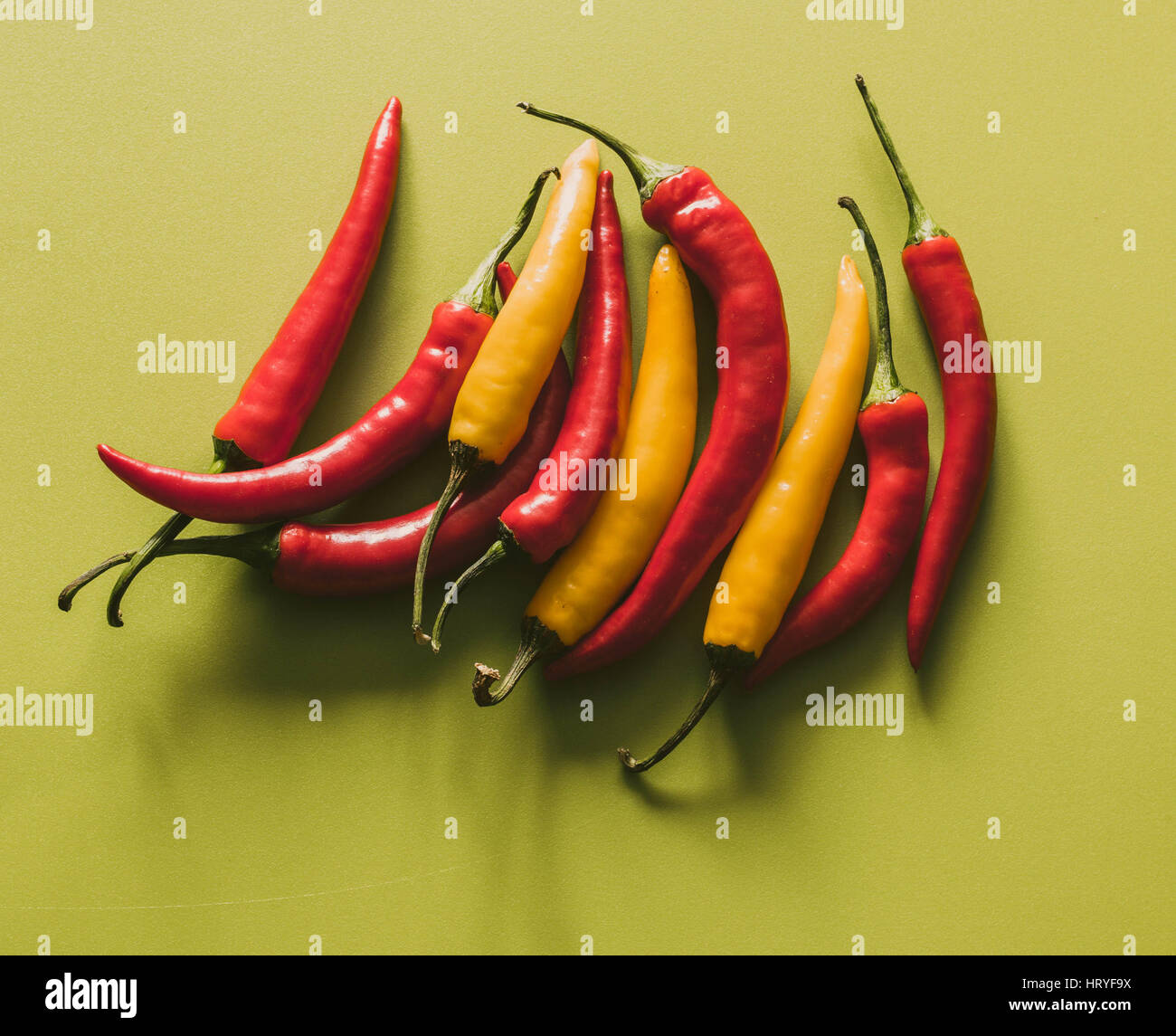 Colorful hot paprika on a green background Stock Photo Alamy
