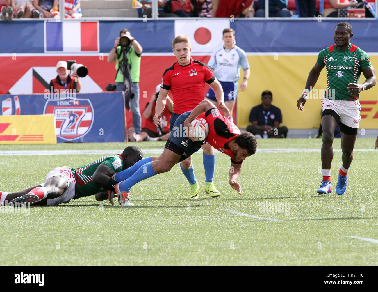 March 5, 2017 - Kenyan Billy Odhiambo is tackled by Russian Dmitry Suhkin during the 2017 USA Sevens International Rugby Tournament game between Kenya and Russia on March 4, 2017 at Sam Boyd Stadium in Las Vegas, Nevada Credit: Marcel Thomas/ZUMA Wire/Alamy Live News Stock Photo