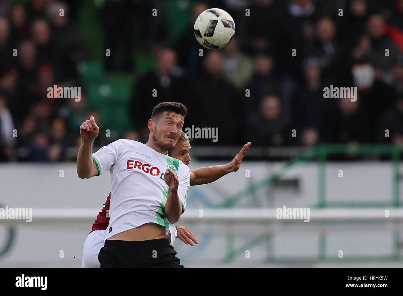 Fuerth, Germany. 5th Mar, 2017. Fuerth's Adam Pinter (front) and Nuremberg's Rurik Gislason in action during the 2nd Bundesliga soccer match between SpVgg Greuther Fuerth and 1. FC Nuremberg at the Stadion am Laubenweg in Fuerth, Germany, 5 March 2017. (EMBARGO CONDITIONS - ATTENTION: Due to the accreditation guidlines, the DFL only permits the publication and utilisation of up to 15 pictures per match on the internet and in online media during the match.) Photo: Daniel Karmann/dpa/Alamy Live News Stock Photo