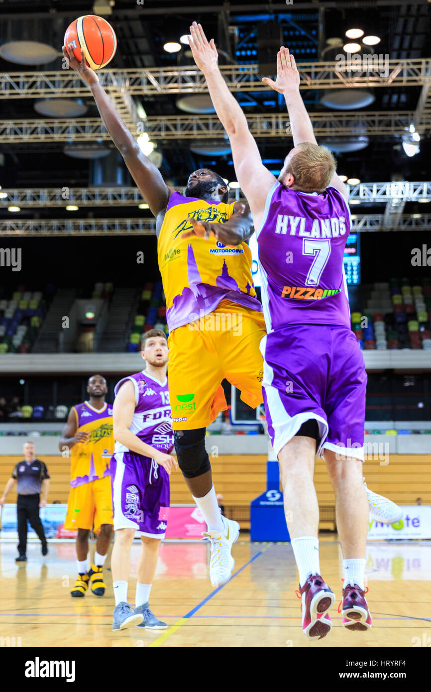 Copper Box Arena, London, 5th Mar 2017. London Lions captain Joe Ikhinmwin jumps up to the basket for a point in the final minutes of the game. Tensions run high in the BBL Championship game between home team London Lions and visitors Leeds Force. London Lions loose 81-92. Credit: Imageplotter News and Sports/Alamy Live News Stock Photo