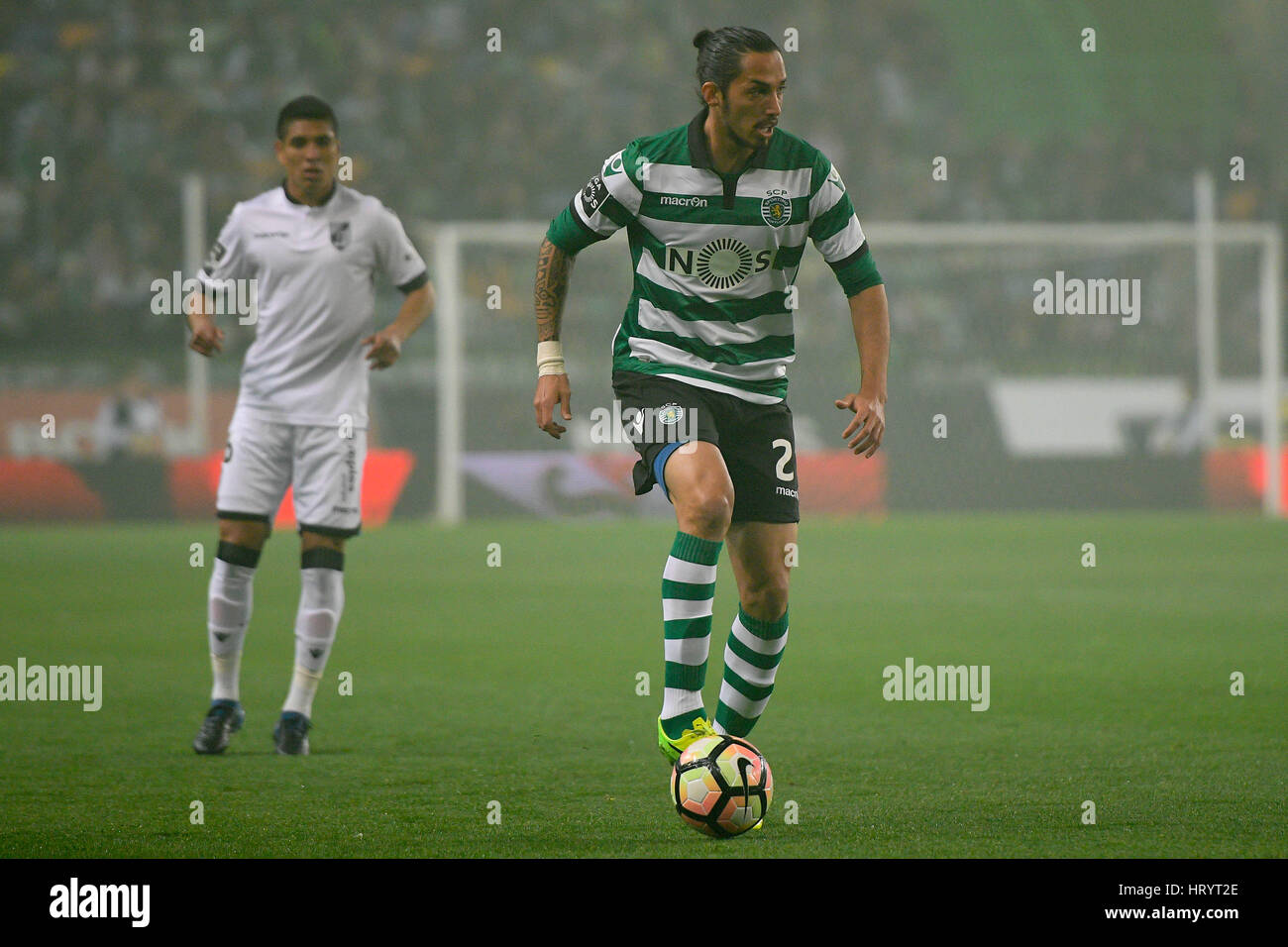 Portugal, Lisbon, Mar. 05, 2017 - FOOTBALL - Schelotto (R), Sporting defender, in action during match between Sporting Clube de Portugal and Vitória Guimarães for Portuguese Football League match at Estádio Alvalade XXI, in Lisbon, Portugal. Credit: Bruno de Carvalho/Alamy Live News Stock Photo