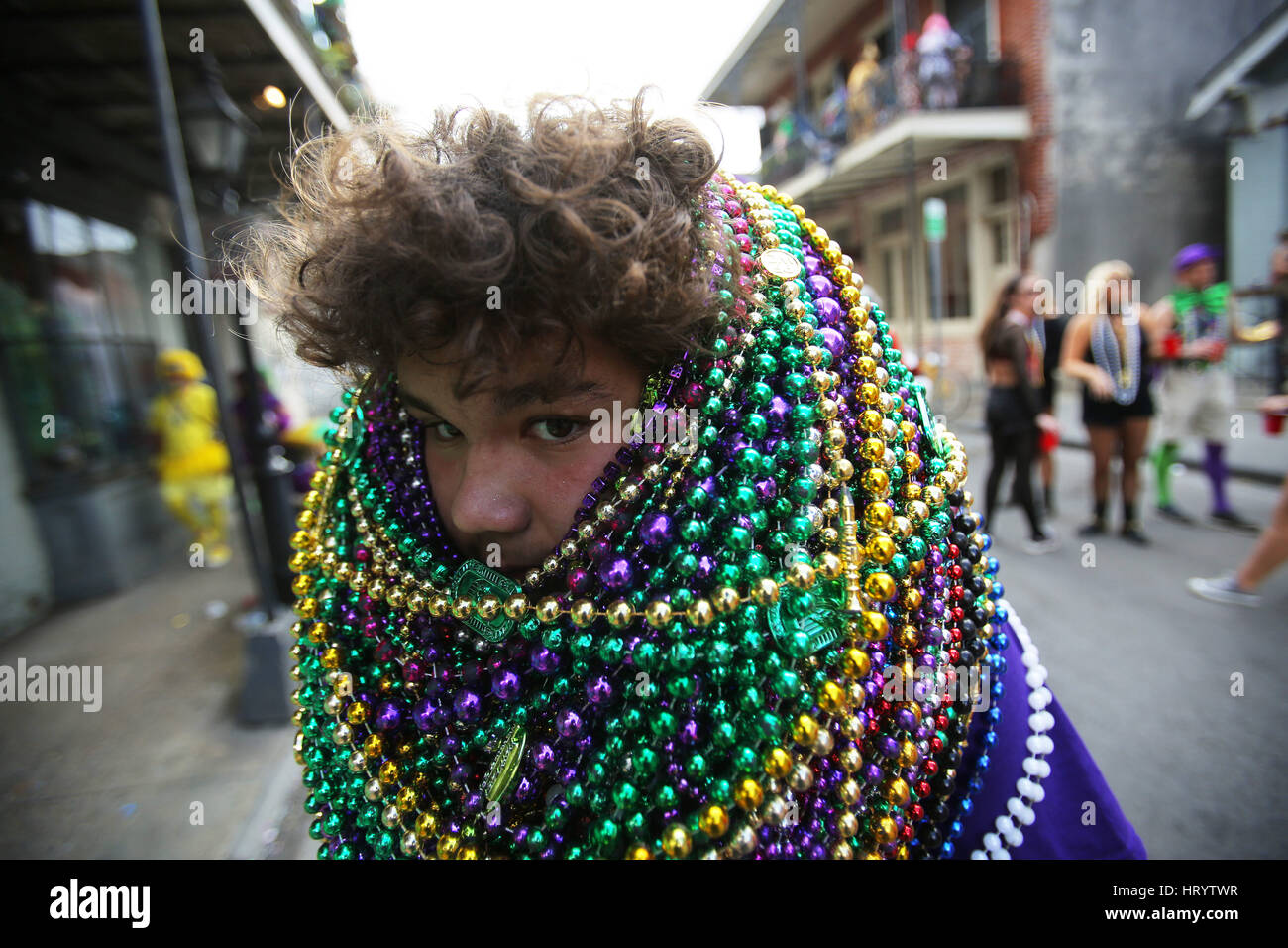 New Orleans, LOUISIANA, USA. 28th Feb, 2017. Xavier Cortez has his face  buried in beads in New Orleans, Louisiana USA on February 28, 2017. New  Orleans is celebrating Fat Tuesday, the last