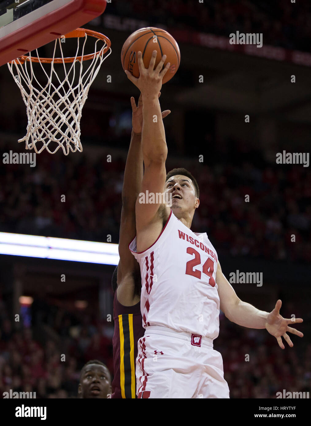 Madison, WI, USA. 5th Mar, 2017. Wisconsin Badgers guard Bronson Koenig #24 scores on a lay up in the second half of the NCAA Basketball game between the Wisconsin Badgers and the Minnesota Golden Gophers at the Kohl Center in Madison, WI. Wisconsin defeated Minnesota 66-49. John Fisher/CSM/Alamy Live News Stock Photo