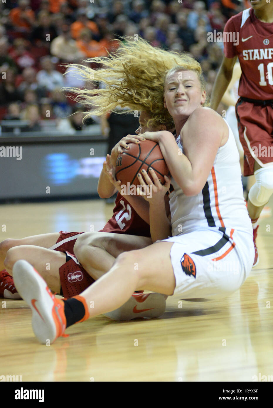 Seattle, WA, USA. 5th Mar, 2017. Stanford's Brittany McPhee (12) and OSU's Marie Gulich (21) fight for a loose ball during the PAC12 women's tournament final between the Oregon State Beavers and the Stanford Cardinal. The game was played at Key Arena in Seattle, WA. Jeff Halstead/CSM/Alamy Live News Stock Photo