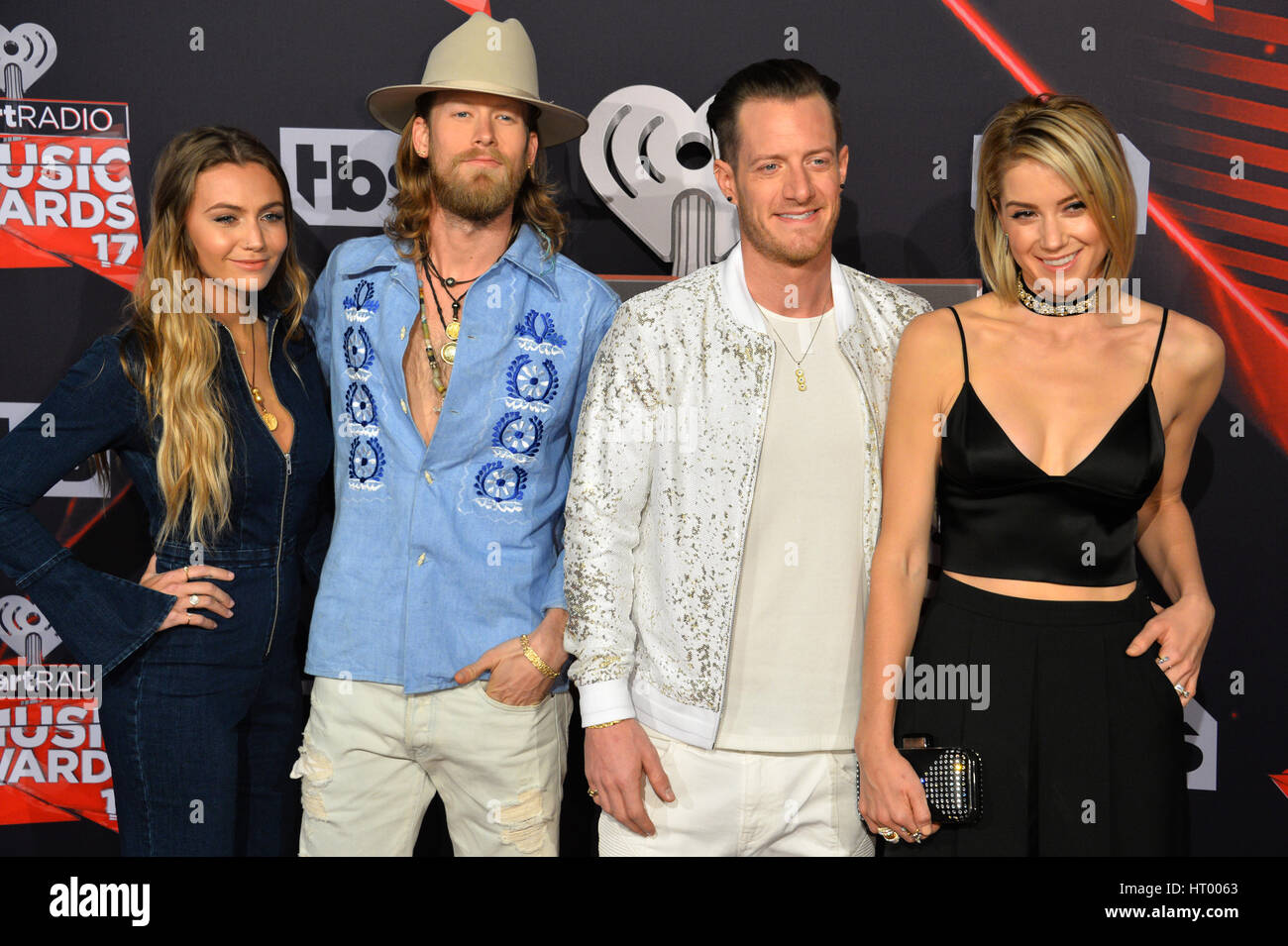 LOS ANGELES, CA. March 05, 2017: Florida Georgia Line - Brian Kelley &  Tyler Hubbard & wives - at the 2017 iHeartRadio Music Awards at The Forum,  Los Angeles. Picture: Sarah Stewart Stock Photo - Alamy