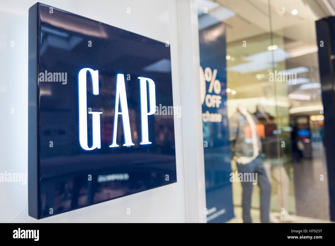 Fairfax, USA - February 18, 2017: Gap storefront with logo by entrance ...