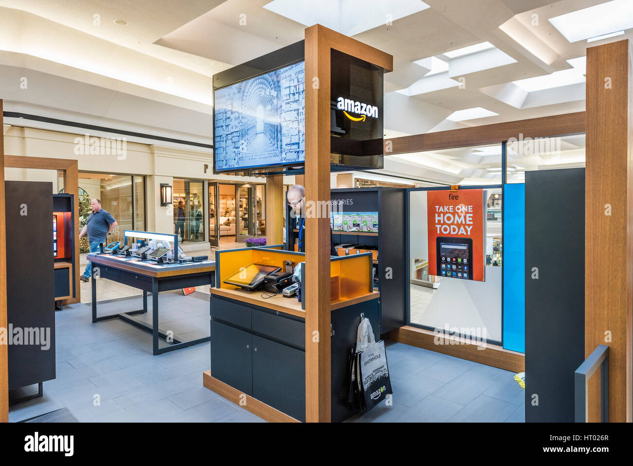 Fairfax, USA - February 18, 2017: Small Amazon store in mall with salesperson and products Stock Photo