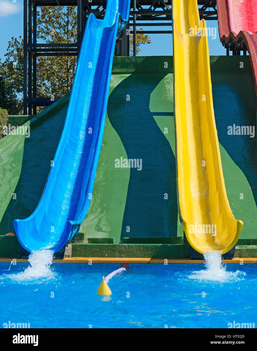 Colorful plastic water-slides in aqua park. Stock Photo