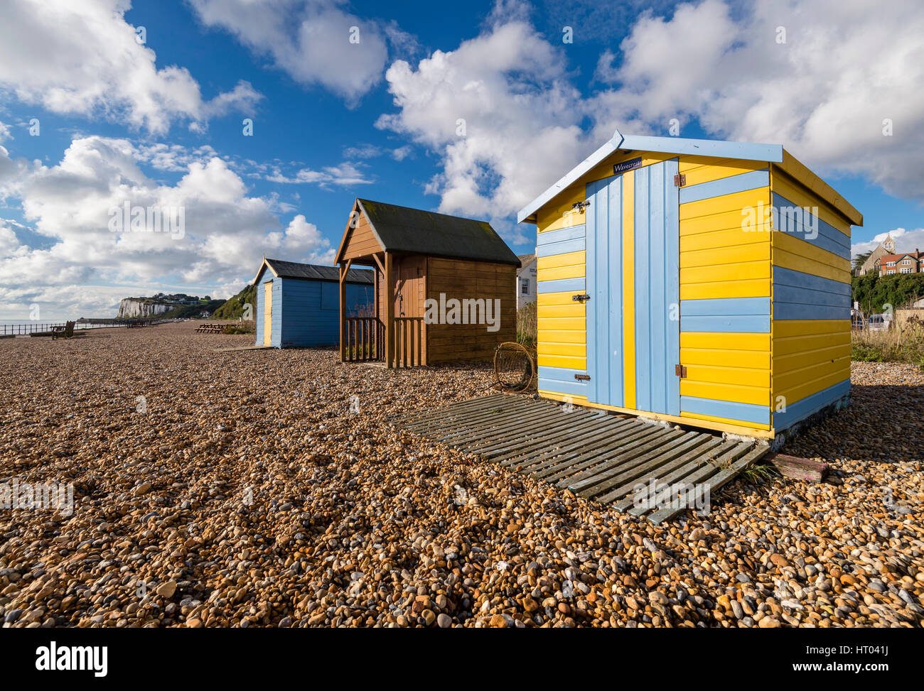 Colourful beach huts on the shore at Kingsdown, Deal, Kent. Stock Photo