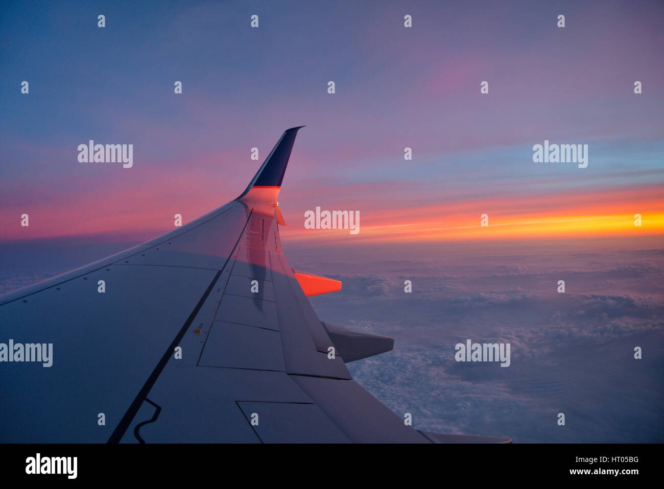 A rare crystal-clear view from the window of a passenger plane. Stock Photo