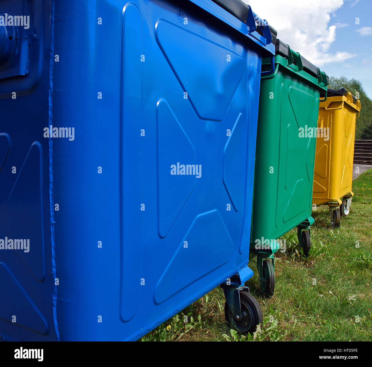 Three colour recycling trash bins for ecological waste sorting Stock