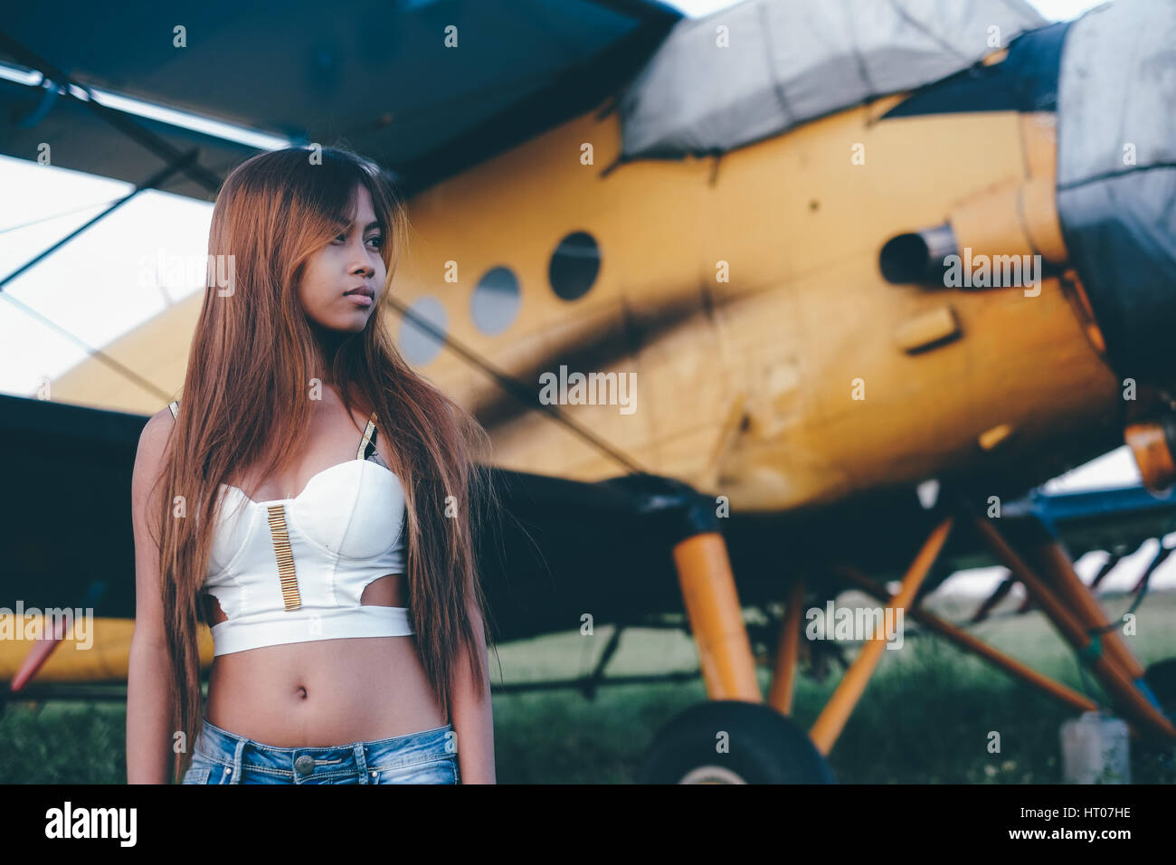 Beautiful female portrait on the airfield,late afternoon Stock Photo