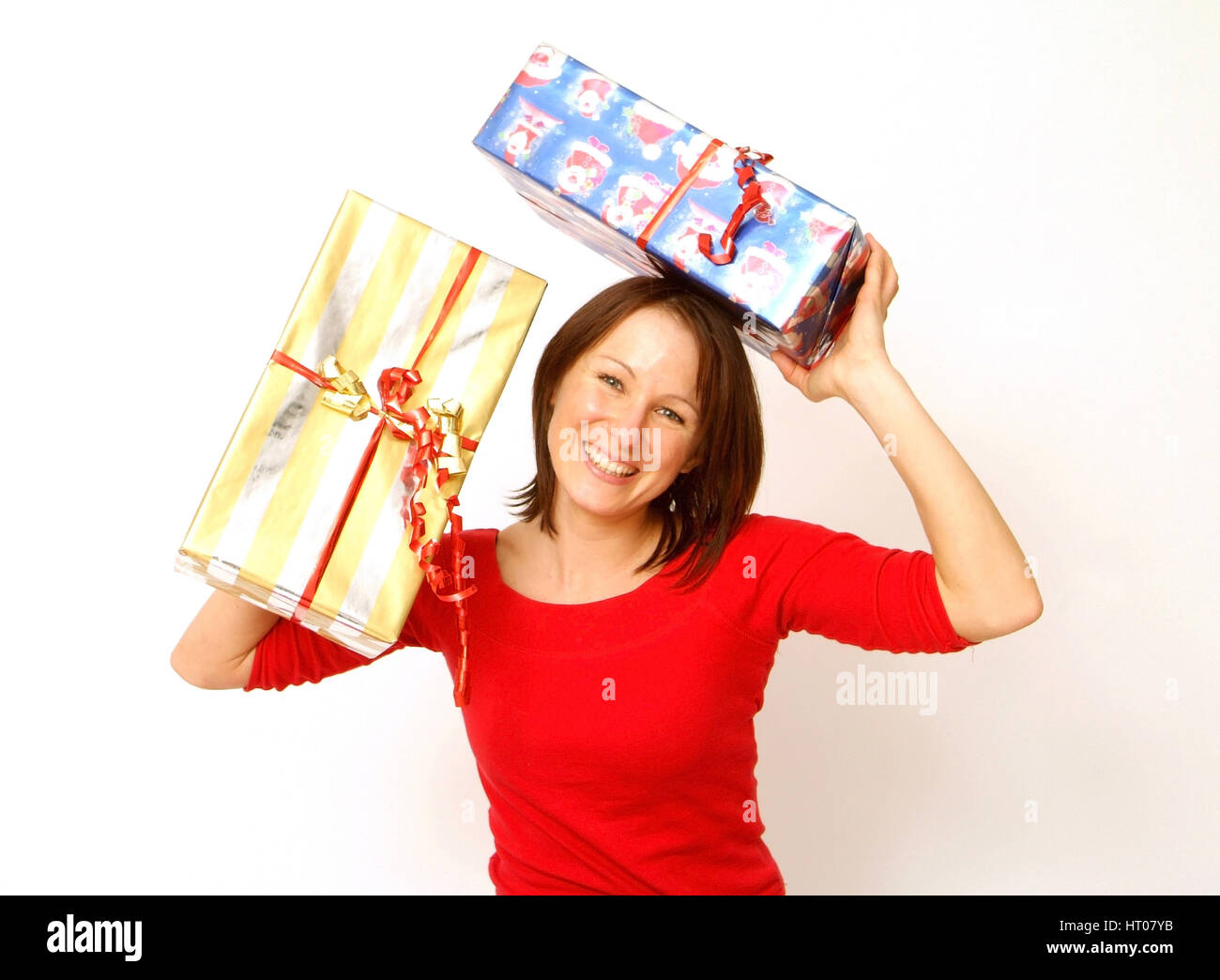 Frau mit Weihnachtsgeschenken - woman with christmas presents Stock Photo