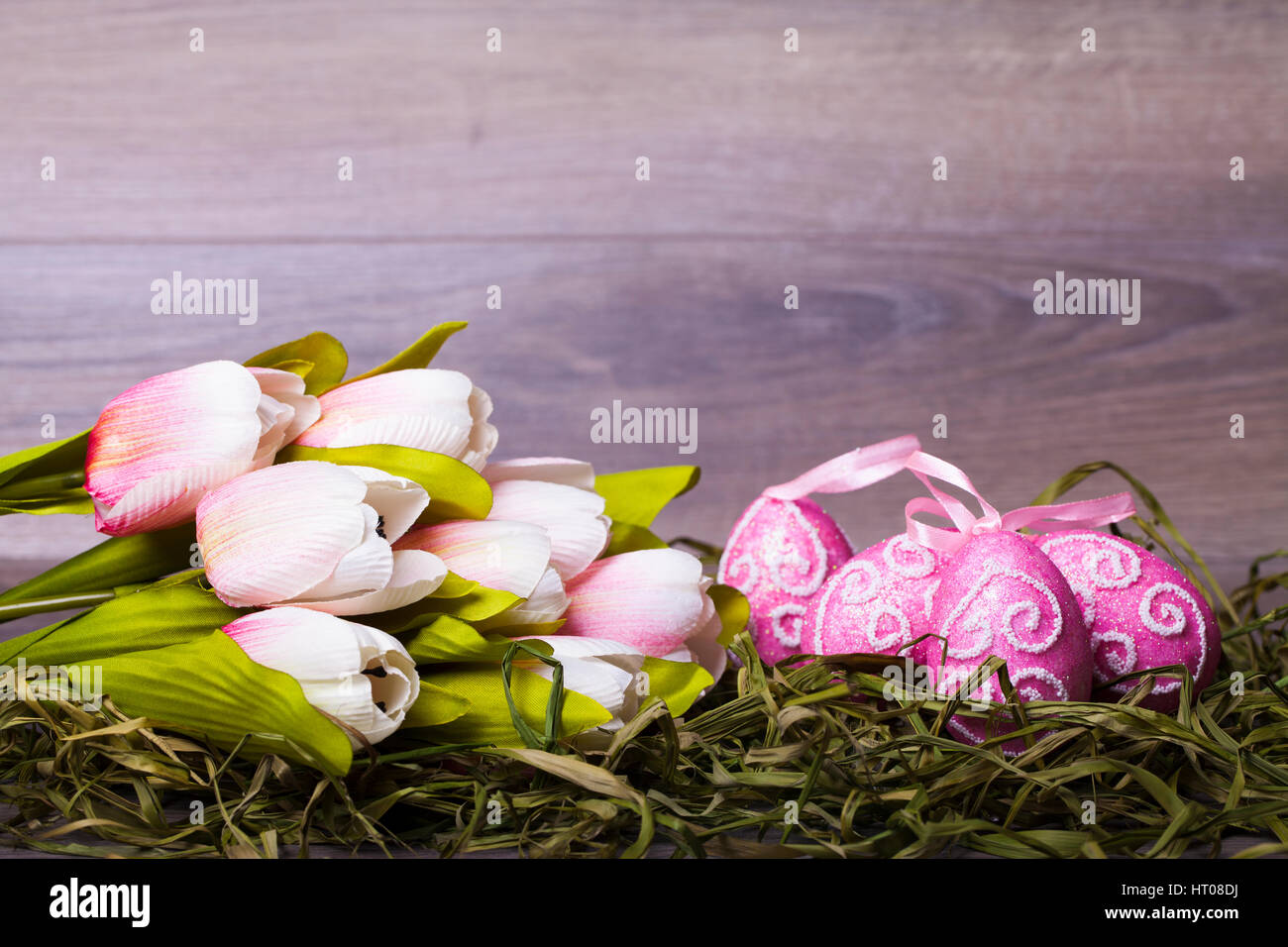 Easter decoration with eggs on a wooden background Stock Photo - Alamy