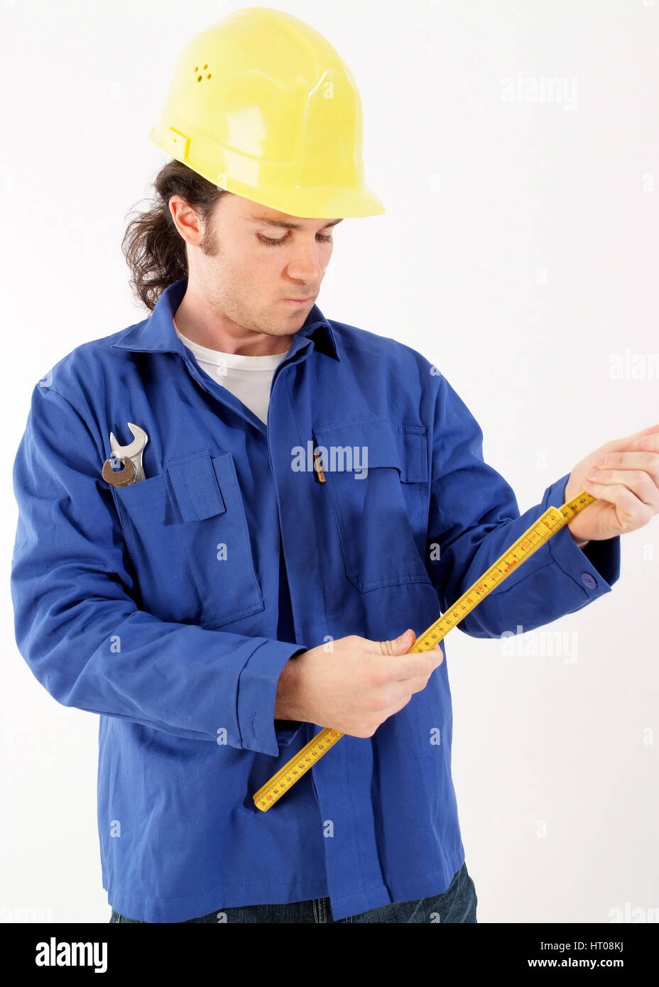 Bauarbeiter mit Blaumann, Bauhelm und Werkzeug - building worker with tools  Stock Photo - Alamy