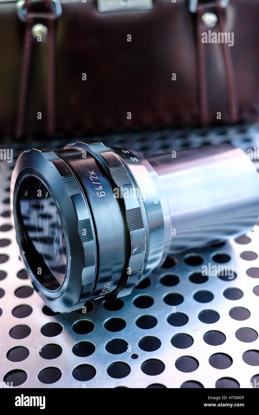 Professional projector lens on metalic background Stock Photo - Alamy
